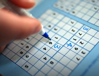 person playing sudoku