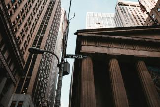 gray streetlight near building by Aditya Vyas courtesy of Unsplash.