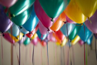 selective focus photography of assorted-color balloons by Adi Goldstein courtesy of Unsplash.