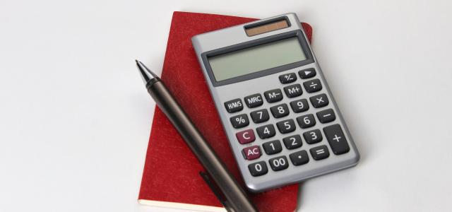 black and silver calculator beside black pen by Recha Oktaviani courtesy of Unsplash.